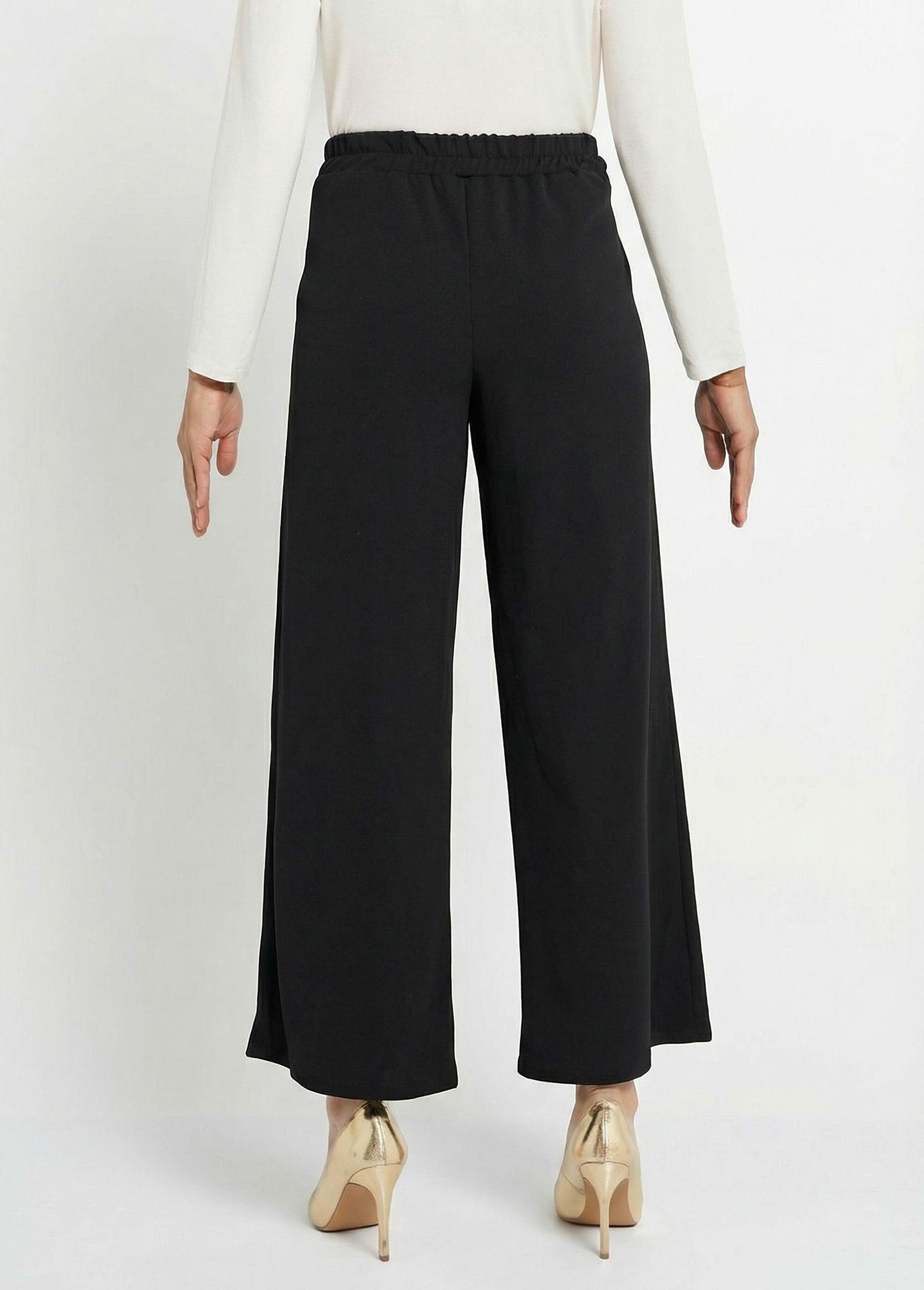 Pantaloni_a_gamba_larga_in_maglia_con_dettagli_metallici_chic_Noir_DO1_slim