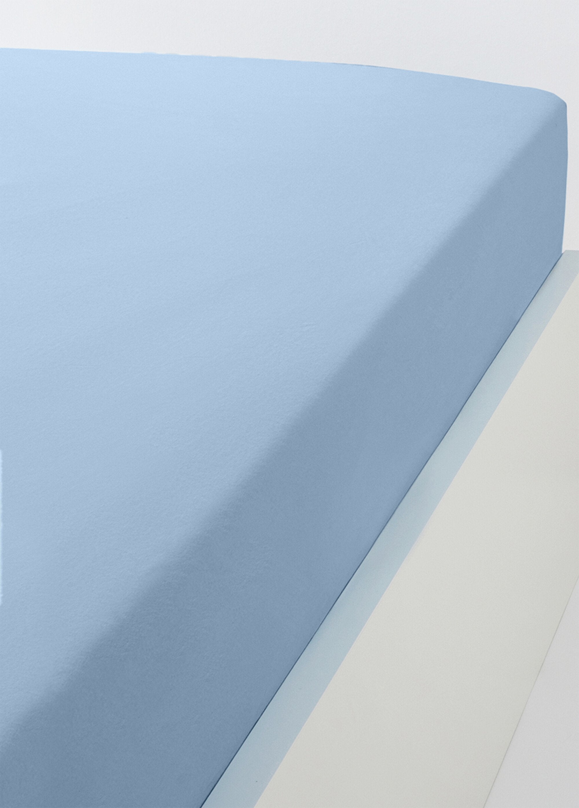 Lenzuolo_a_pieghe_in_jersey_di_cotone_tinta_unita_-_set_da_2_Lotto_bianco+blu2_FA1_slim