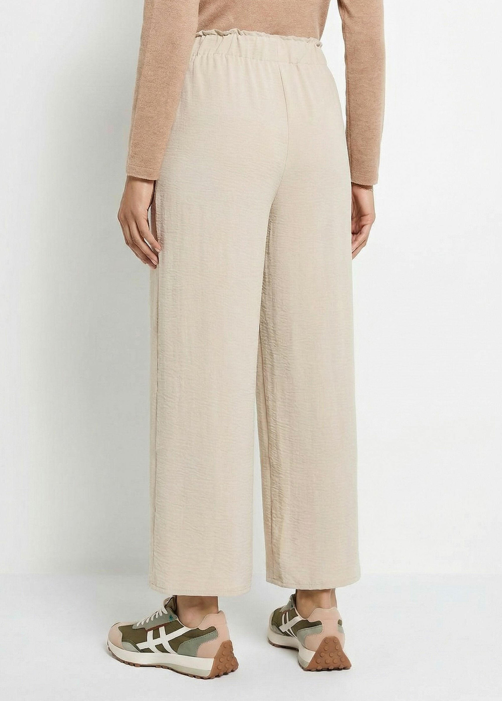 Pantaloni_a_gamba_larga_in_crêpe_fluido_Beige_DO1_slim
