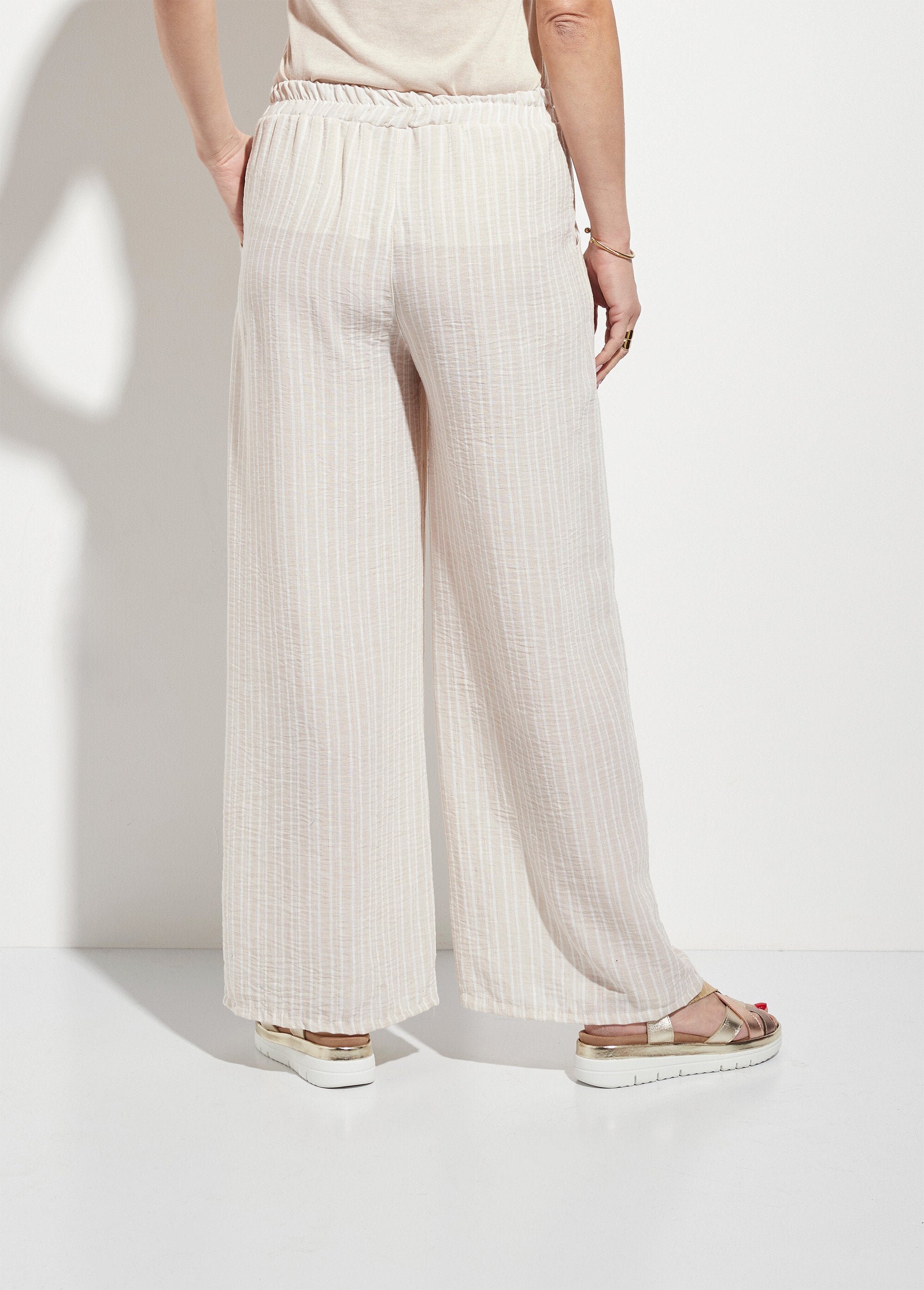 Pantaloni_fluidi_a_gamba_larga_in_lino_a_righe_Beige_DO1_slim